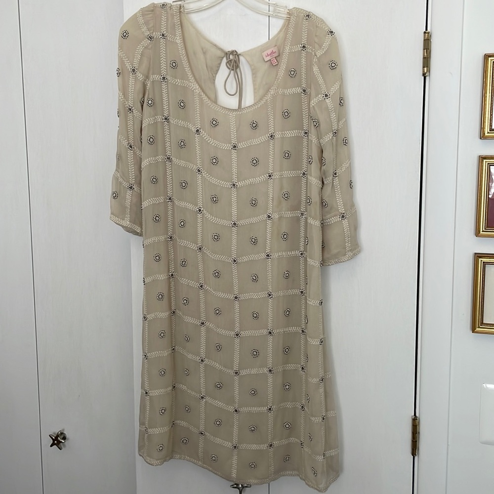 Off-white dress with beading and key-hole back